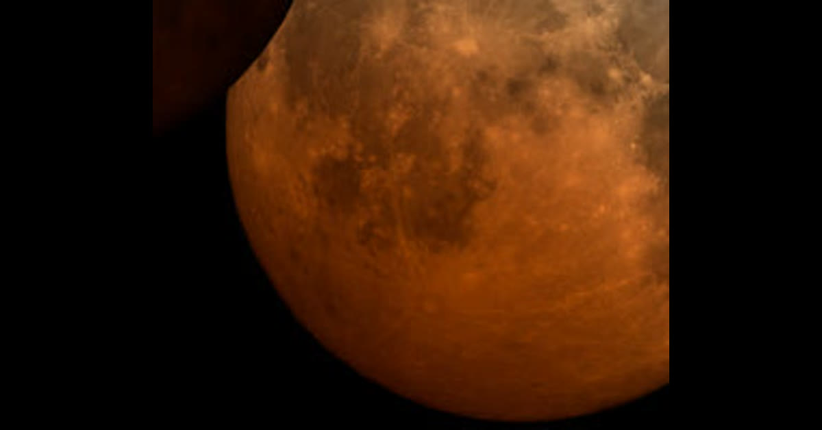 Deep partial lunar eclipse of 27–28 August 2026 at greatest eclipse, copper-red Moon with a bright northern sliver.